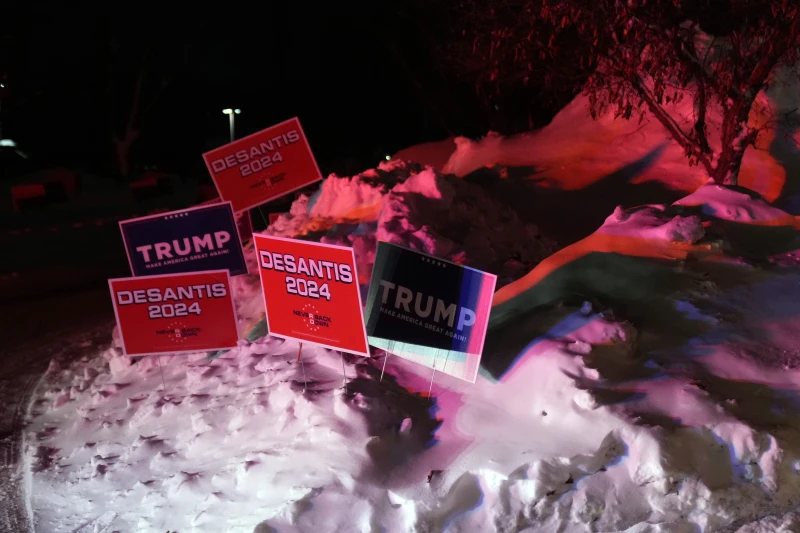 Campaign signs outside a caucus site at Horizon Events Center, in Clive, Iowa, Monday, Jan. 15, 2024. (AP Photo/Andrew Harnik)